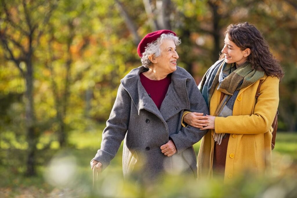 Older woman walking with her adult daughter