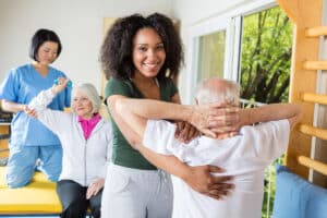 Caregivers and seniors in a fitness class