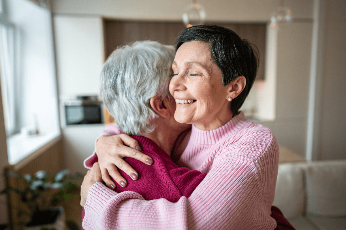 Joyful serene happy woman lovingly embraces husband, celebrating reunion after separation. Holiday greetings, strong family bonds, trust and warmth in relationship, emotional connection and support